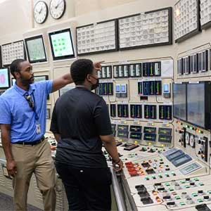 a teacher showing around a command center