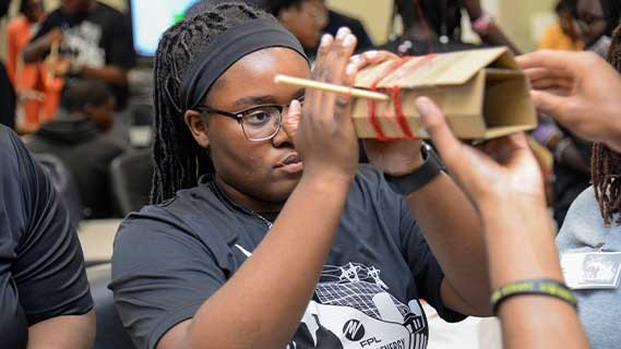 A student making a craft